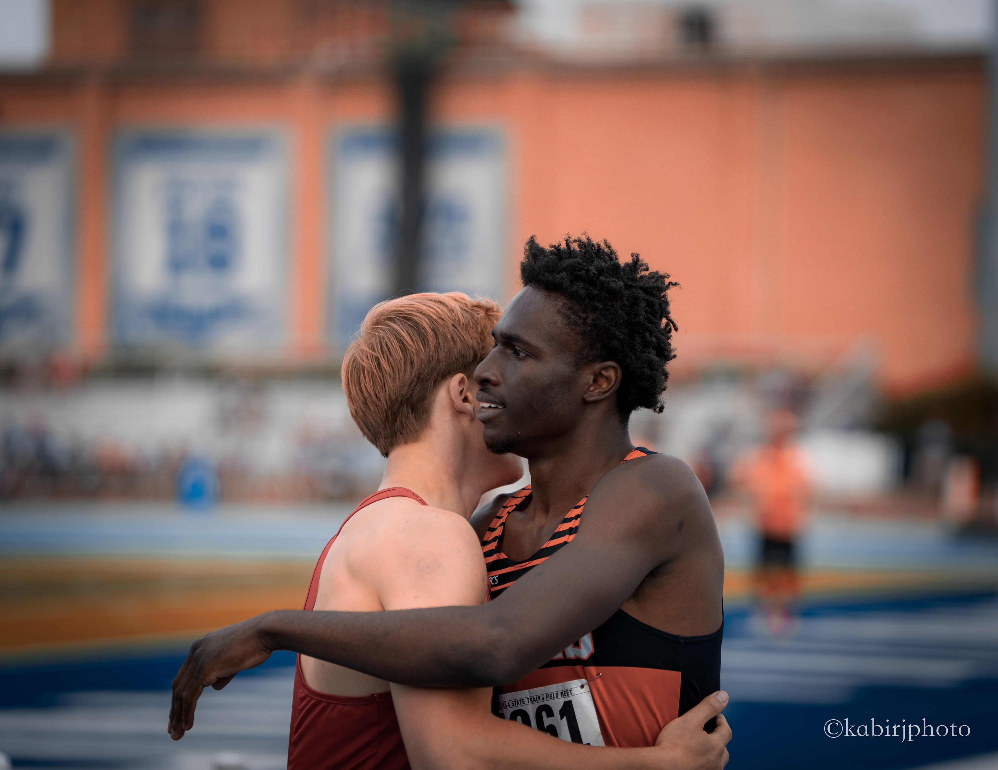 Athletes embrace after race