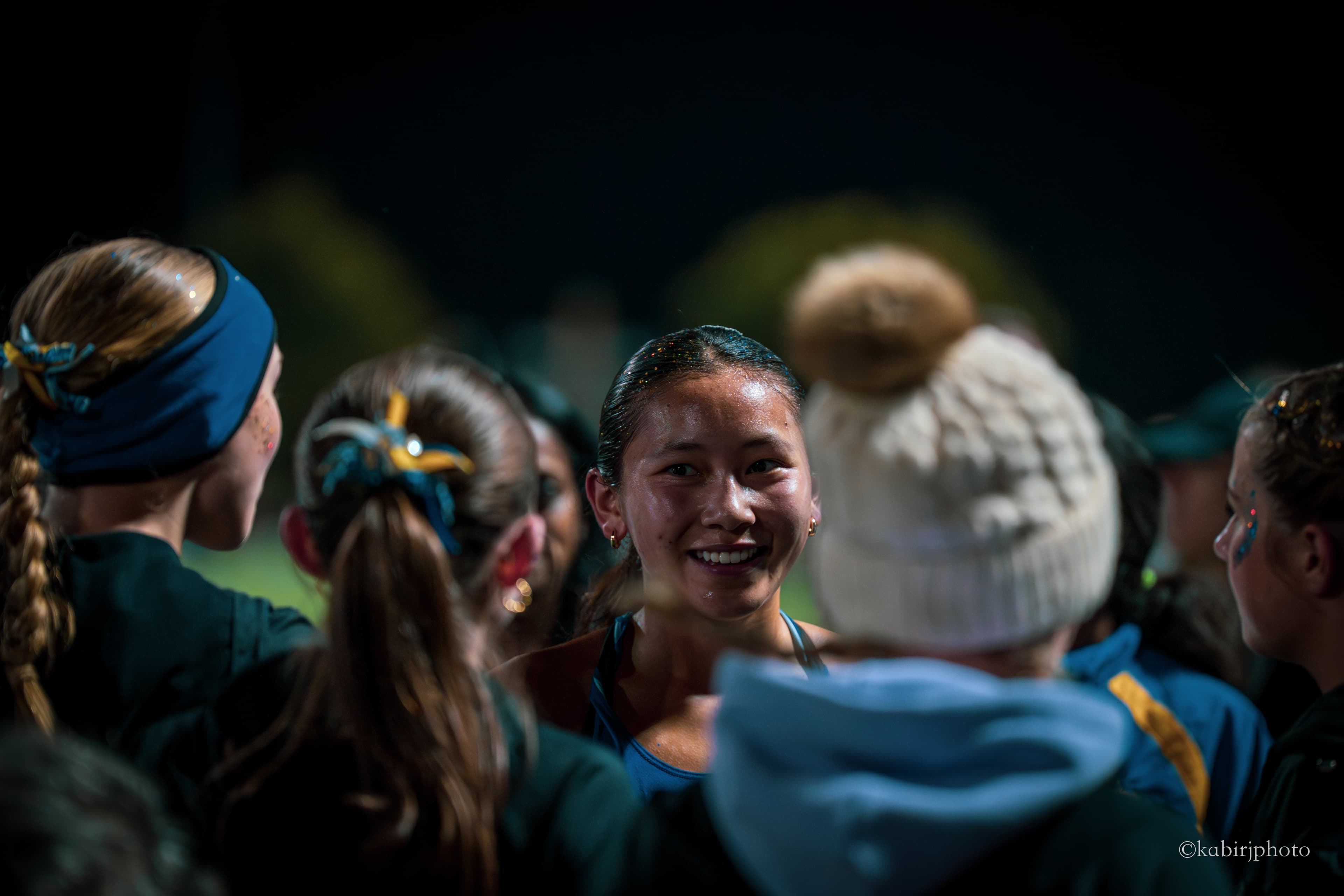 Athlete celebrates with teammates